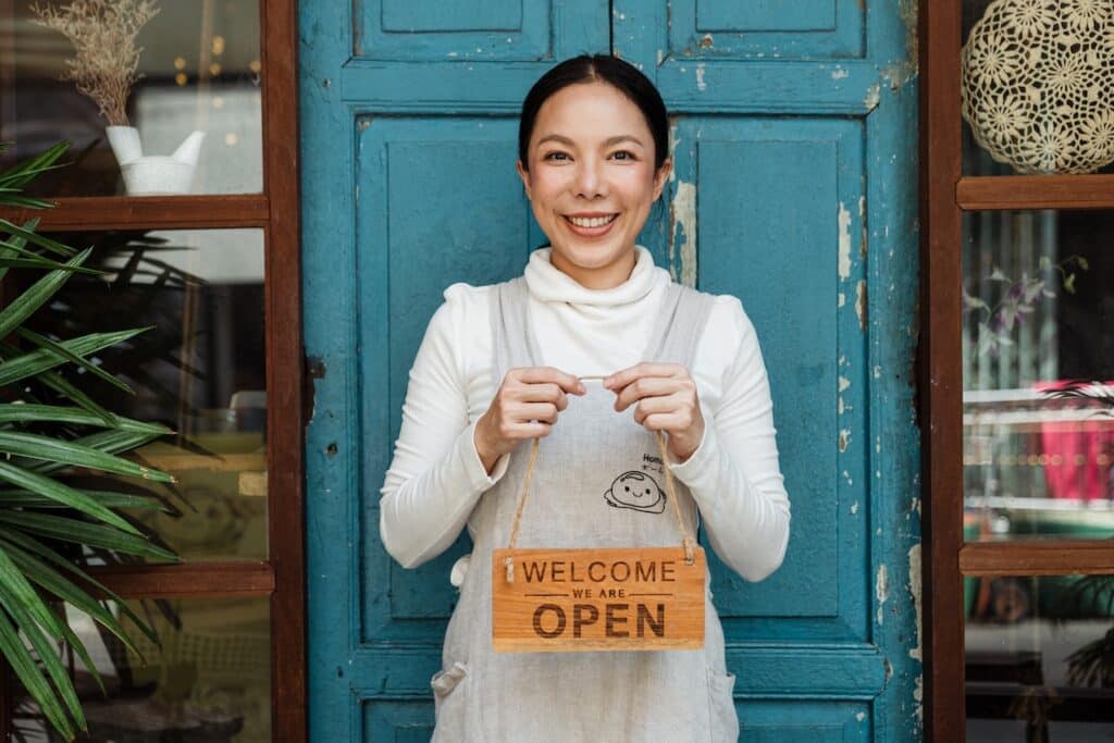 lady owner opening store embracing energy efficiency for small businesses