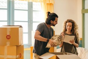 Couple looking at their house moving tips checklist